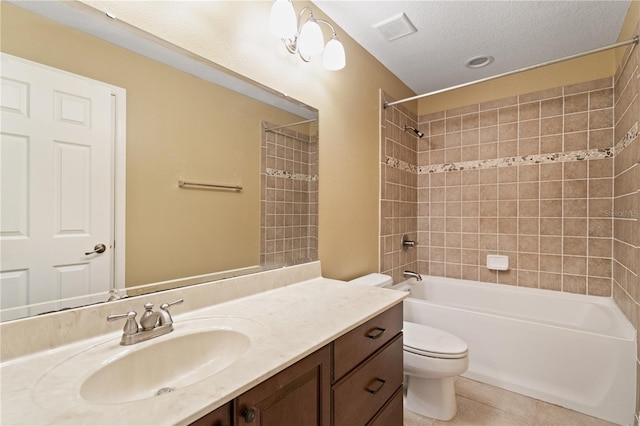 bathroom featuring tile patterned flooring, toilet, vanity, visible vents, and washtub / shower combination