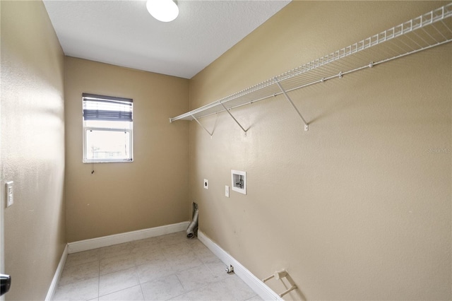 clothes washing area featuring hookup for a washing machine, hookup for a gas dryer, laundry area, baseboards, and electric dryer hookup