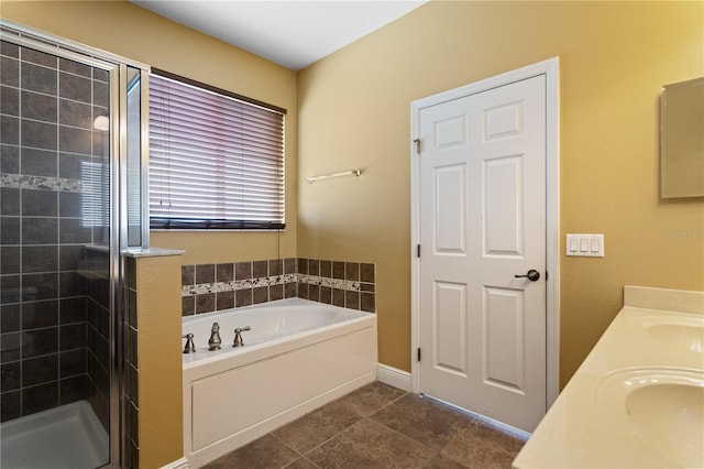 bathroom with a stall shower, tile patterned flooring, a sink, and a bath