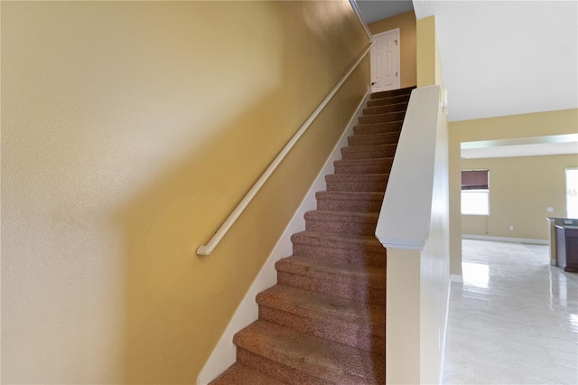 staircase with baseboards