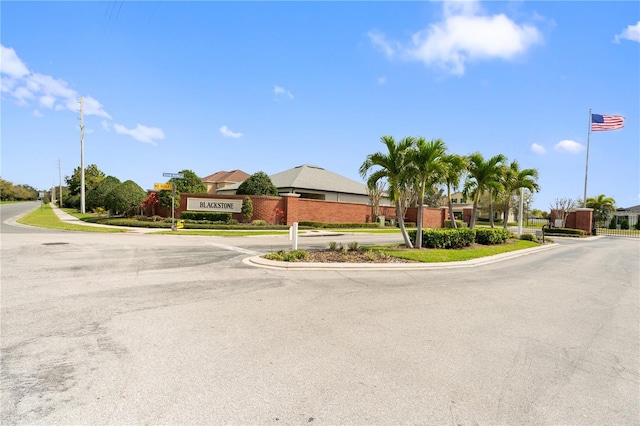 view of road with sidewalks and curbs