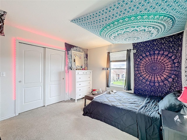 bedroom featuring a closet and carpet flooring