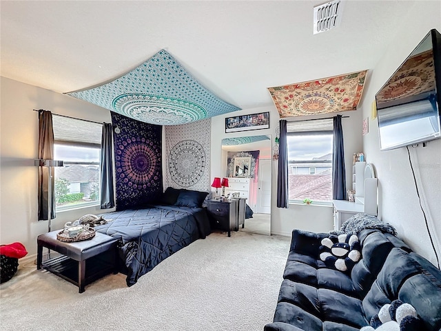 bedroom featuring carpet flooring, visible vents, and baseboards