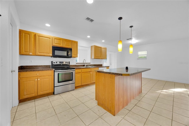 kitchen with stainless steel electric range oven, dark countertops, a kitchen island, a sink, and black microwave