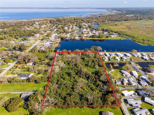 aerial view featuring a water view and a residential view