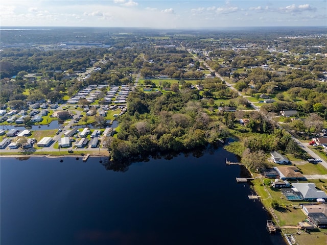 drone / aerial view with a water view and a residential view