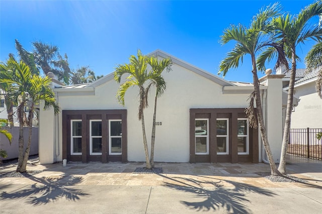 view of property with fence