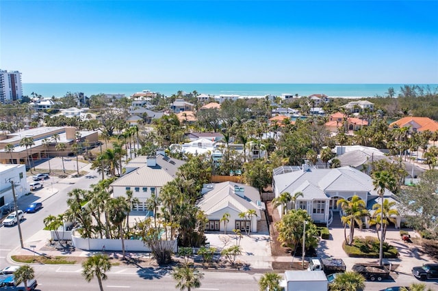 birds eye view of property featuring a water view and a residential view