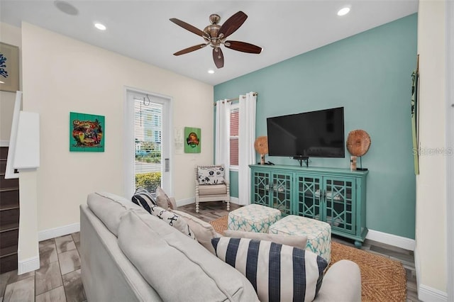 living room featuring recessed lighting, ceiling fan, baseboards, and wood finished floors