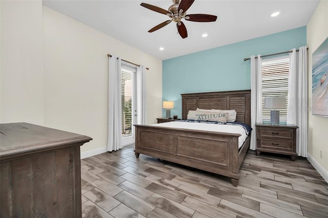 bedroom featuring access to exterior, wood finish floors, baseboards, and a ceiling fan