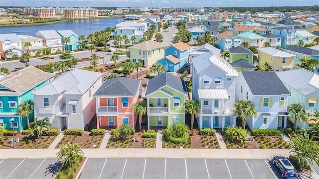 bird's eye view with a water view and a residential view