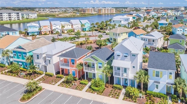 bird's eye view featuring a water view and a residential view