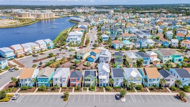 birds eye view of property featuring a water view and a residential view