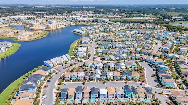 birds eye view of property with a water view and a residential view