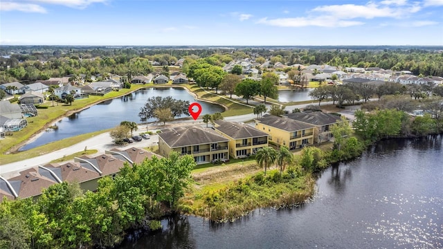 birds eye view of property featuring a residential view and a water view