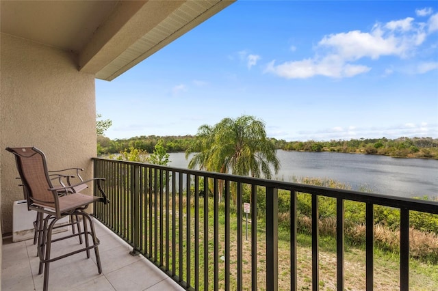 balcony featuring a water view