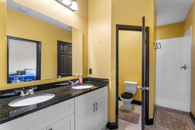 full bathroom featuring toilet, tile patterned flooring, a sink, and visible vents