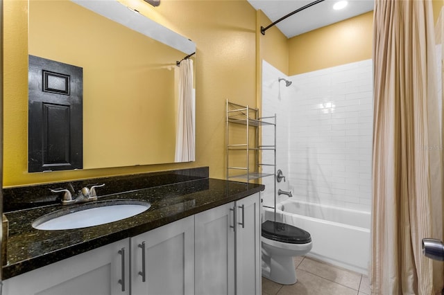 full bathroom featuring toilet, vanity, shower / tub combo with curtain, and tile patterned floors