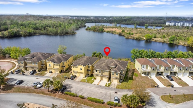 birds eye view of property featuring a residential view and a water view