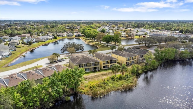 birds eye view of property featuring a water view and a residential view