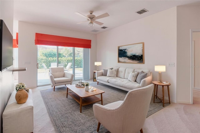 153 Ventana Dr, Poinciana, FL 34759 - living area with light carpet, visible vents, baseboards, and ceiling fan