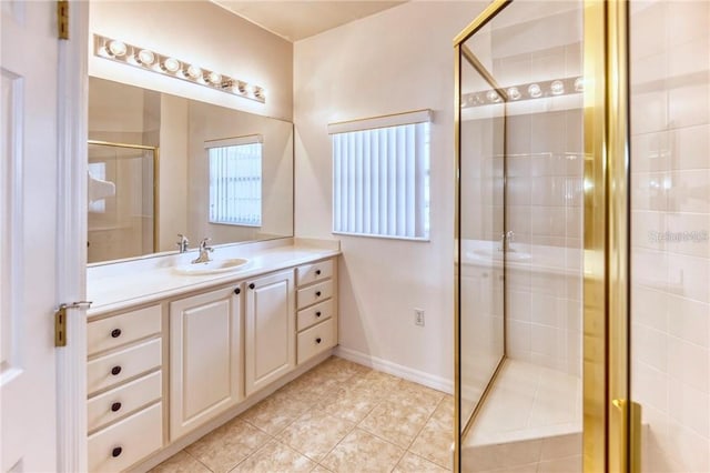 153 Ventana Dr, Poinciana, FL 34759 - bathroom with vanity, a shower stall, baseboards, and tile patterned floors