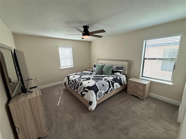 bedroom featuring baseboards, carpet, a ceiling fan, and a textured ceiling