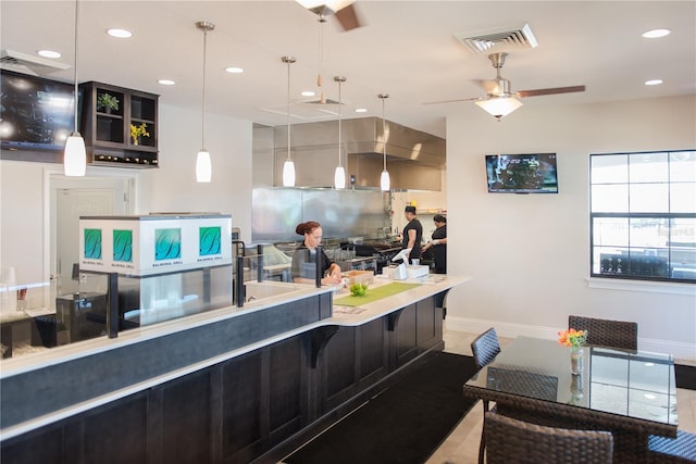 kitchen featuring visible vents, baseboards, ceiling fan, decorative backsplash, and recessed lighting