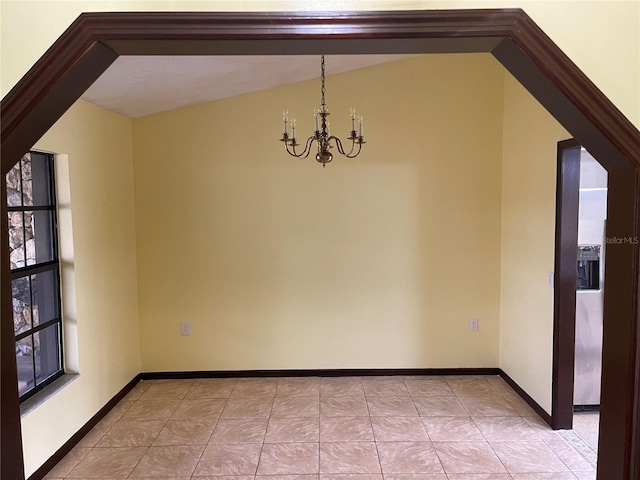 unfurnished dining area featuring lofted ceiling, a notable chandelier, baseboards, and light tile patterned floors