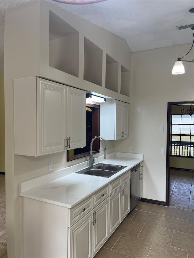 kitchen with a sink, a towering ceiling, baseboards, light countertops, and dishwasher