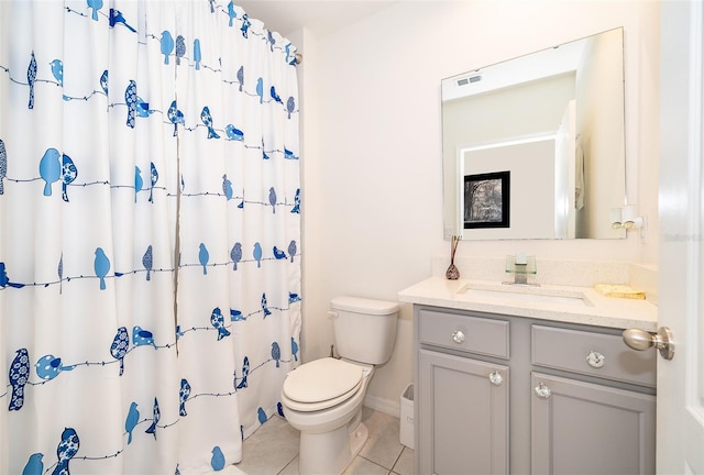 bathroom featuring curtained shower, toilet, vanity, visible vents, and tile patterned floors