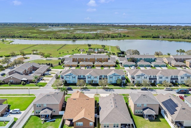 bird's eye view with a water view and a residential view