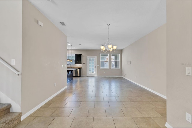 unfurnished living room with light tile patterned floors, baseboards, stairs, and a chandelier