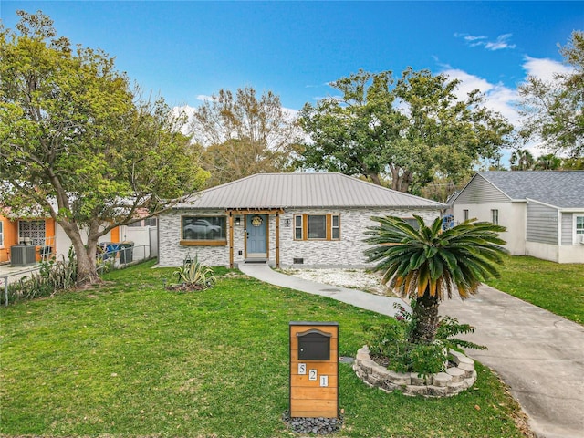 single story home with a front yard, crawl space, metal roof, and fence