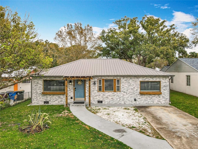 ranch-style house featuring a front yard, crawl space, and metal roof