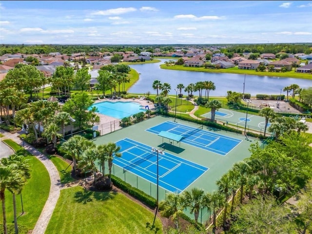 birds eye view of property featuring a water view and a residential view