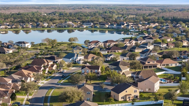 drone / aerial view featuring a residential view and a water view