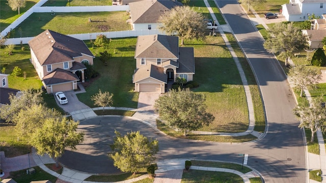 birds eye view of property with a residential view