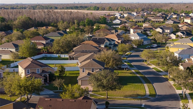 birds eye view of property with a residential view