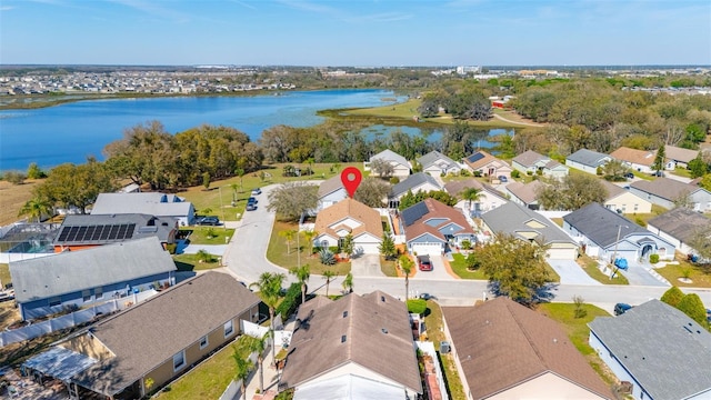 bird's eye view with a residential view and a water view