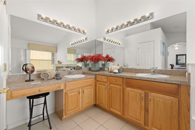 bathroom featuring double vanity, tile patterned flooring, and a sink