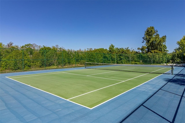 view of sport court with fence