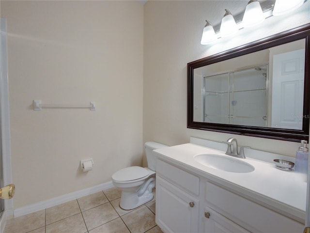 full bath featuring tile patterned flooring, toilet, a shower with shower door, vanity, and baseboards