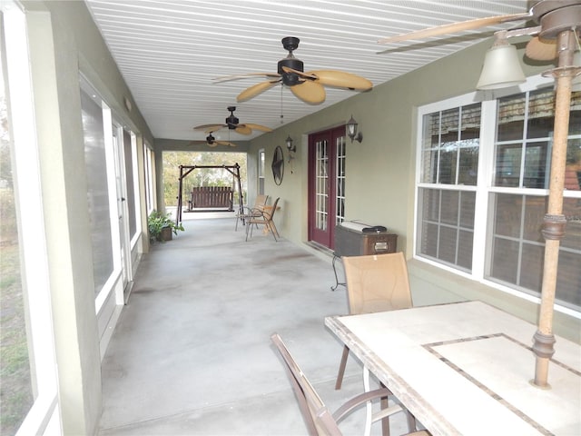 view of patio / terrace featuring a ceiling fan and french doors