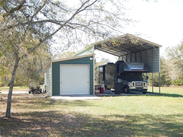 garage featuring driveway and a carport