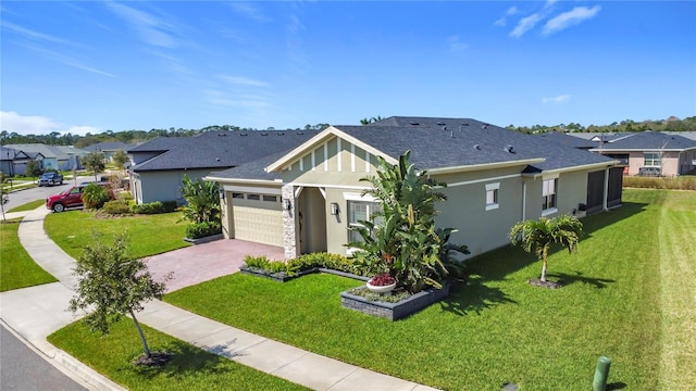 view of front of house featuring roof with shingles, a garage, a residential view, driveway, and a front lawn