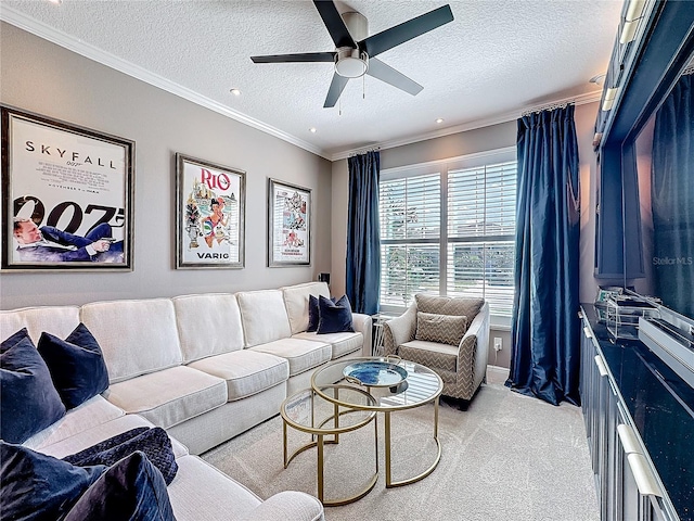 living room featuring crown molding, ceiling fan, a textured ceiling, and light colored carpet