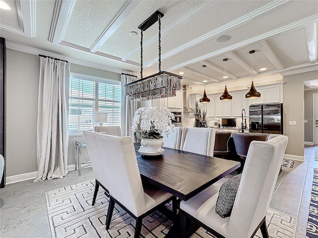 dining space with crown molding, a textured ceiling, and baseboards