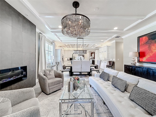 living area featuring ornamental molding and a chandelier