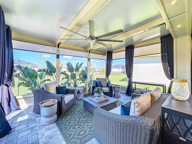 interior space featuring outdoor lounge area and a ceiling fan